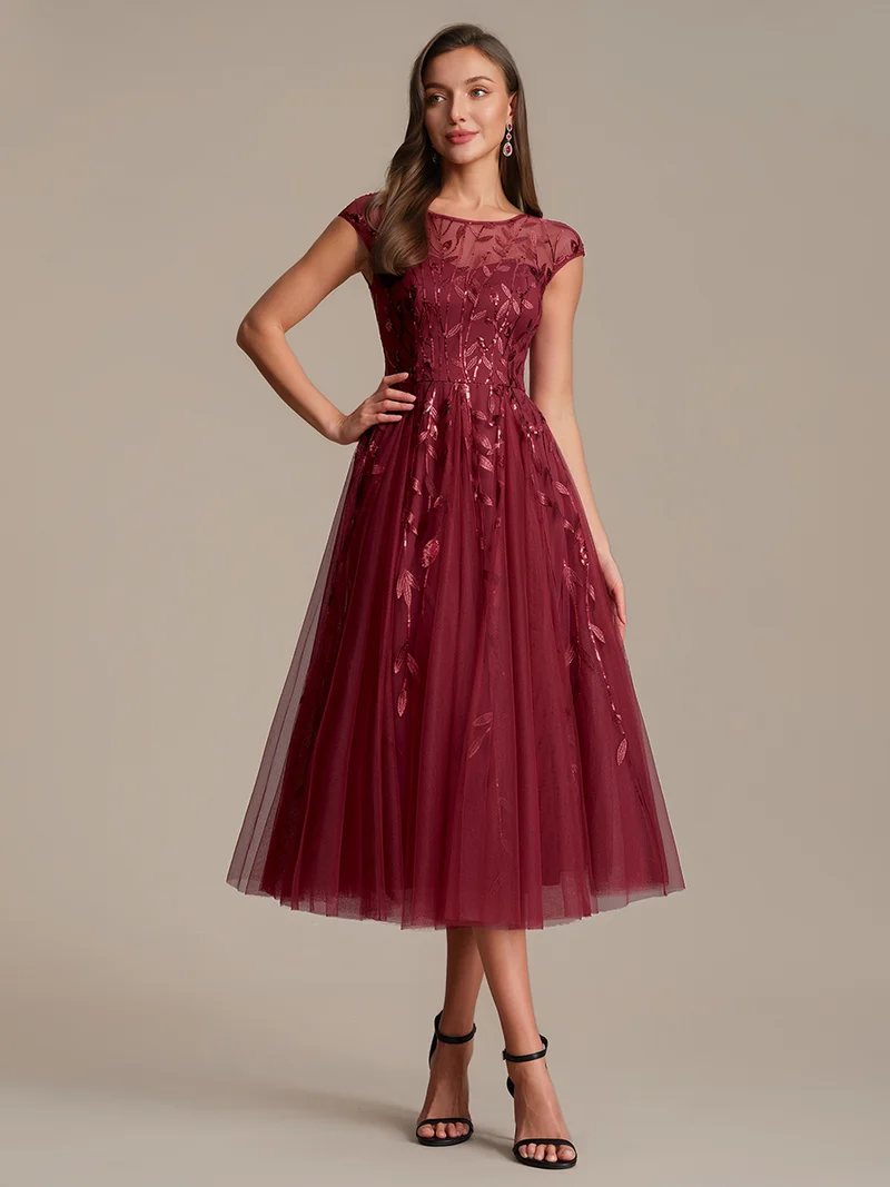 Robe de soirée mi-longue à paillettes avec manches cape