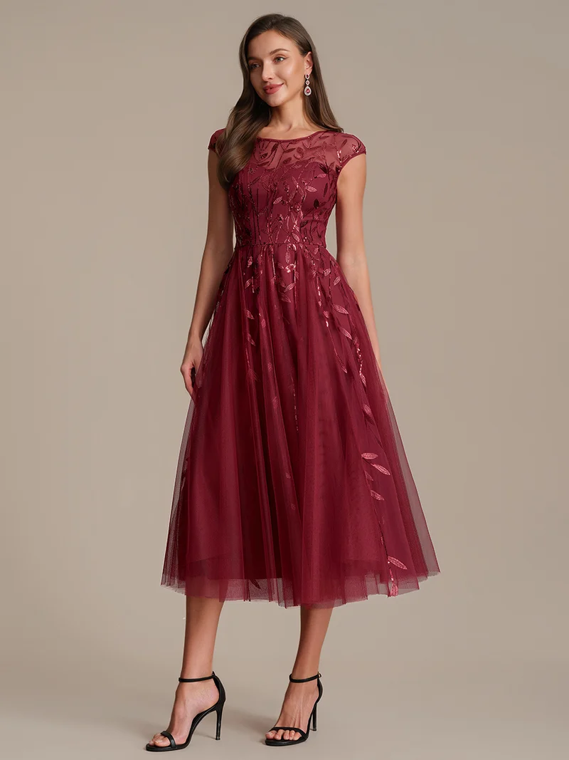 Robe de soirée mi-longue à paillettes avec manches cape