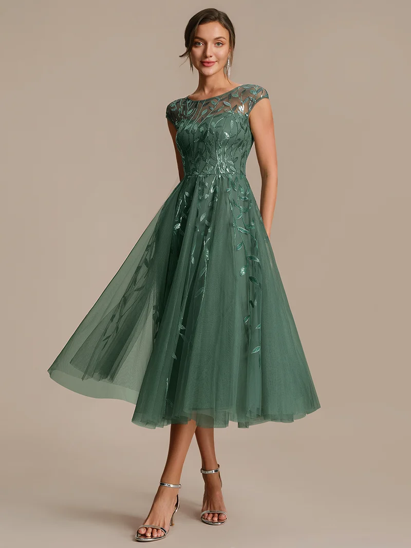 Robe de soirée mi-longue à paillettes avec manches cape