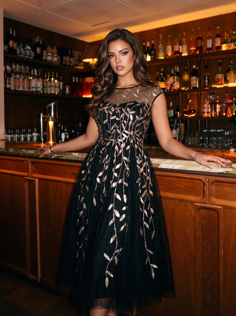 Robe de soirée mi-longue à paillettes avec manches cape
