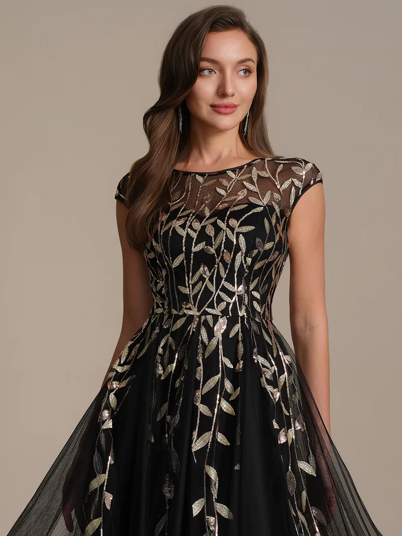 Robe de soirée mi-longue à paillettes avec manches cape