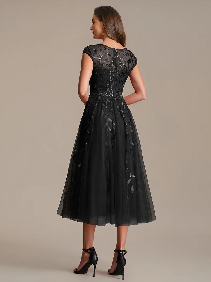 Robe de soirée mi-longue à paillettes avec manches cape