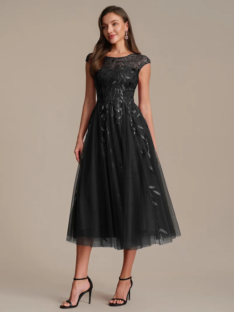 Robe de soirée mi-longue à paillettes avec manches cape
