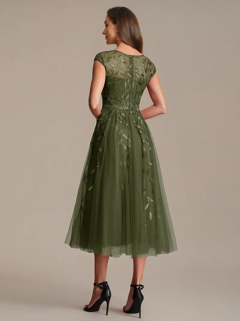 Robe de soirée mi-longue à paillettes avec manches cape