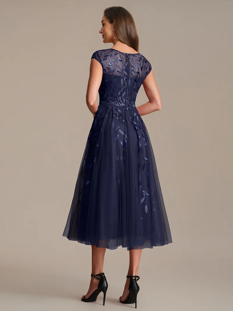 Robe de soirée mi-longue à paillettes avec manches cape