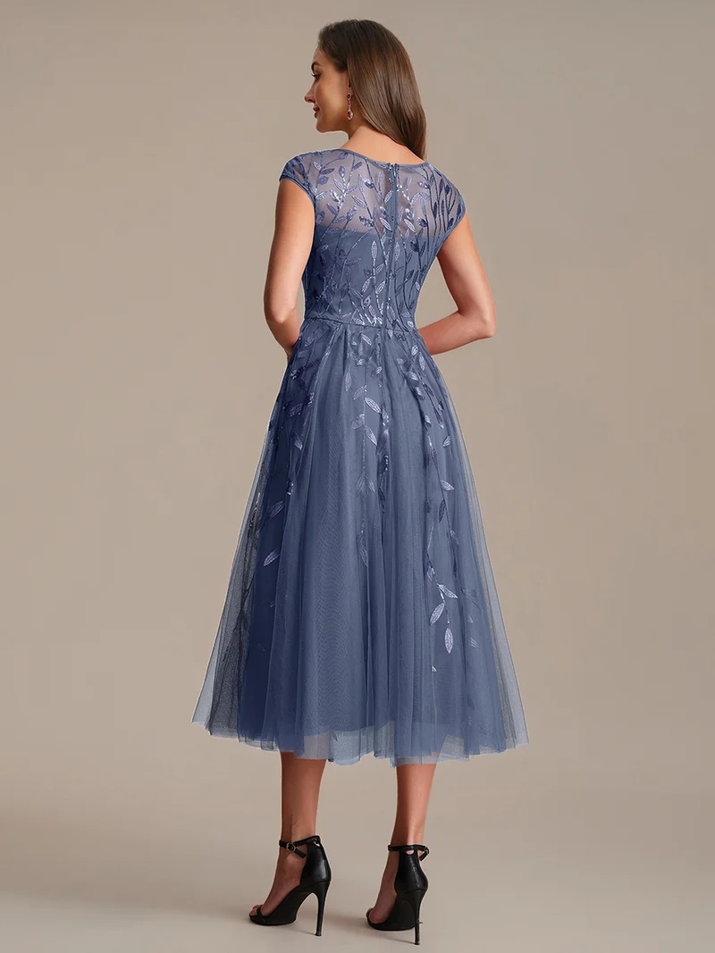 Robe de soirée mi-longue à paillettes avec manches cape
