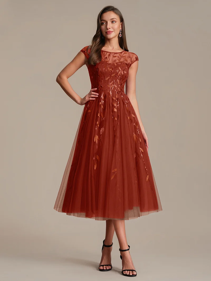 Robe de soirée mi-longue à paillettes avec manches cape