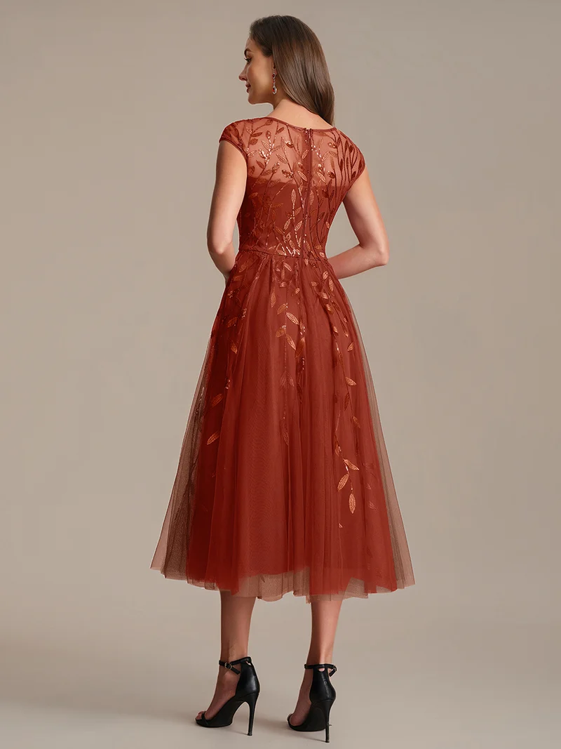 Robe de soirée mi-longue à paillettes avec manches cape