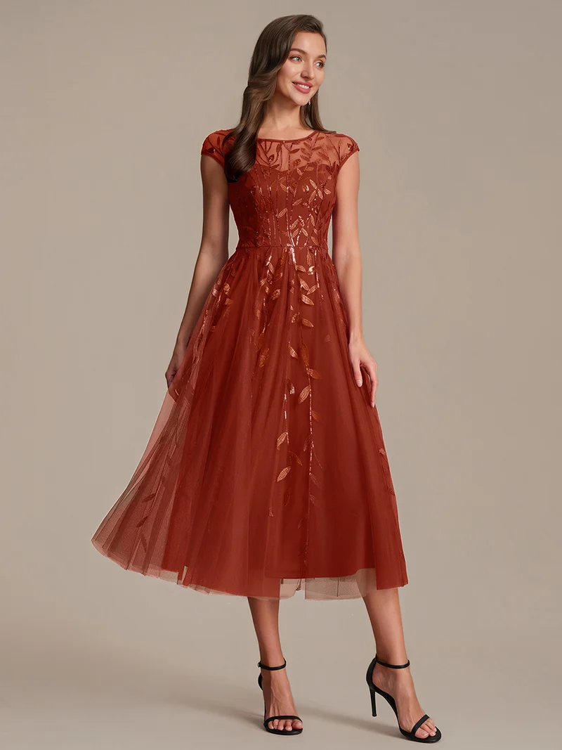 Robe de soirée mi-longue à paillettes avec manches cape