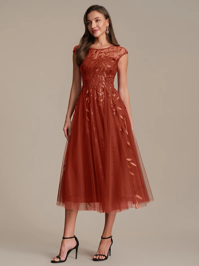 Robe de soirée mi-longue à paillettes avec manches cape