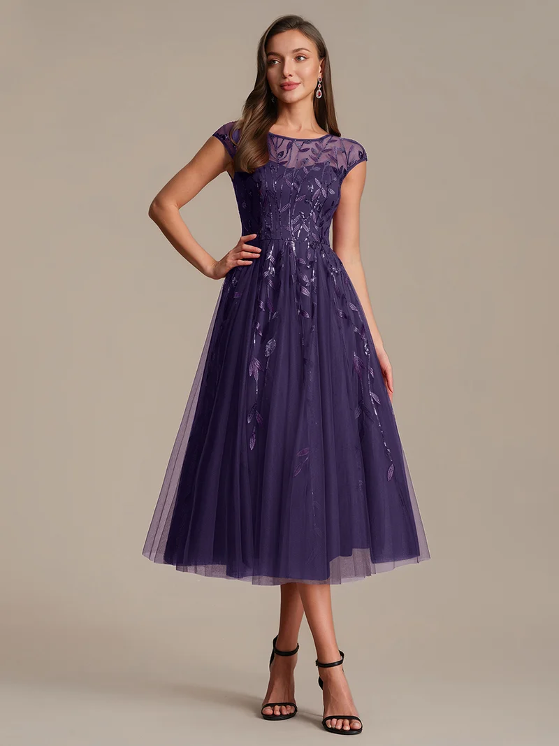 Robe de soirée mi-longue à paillettes avec manches cape
