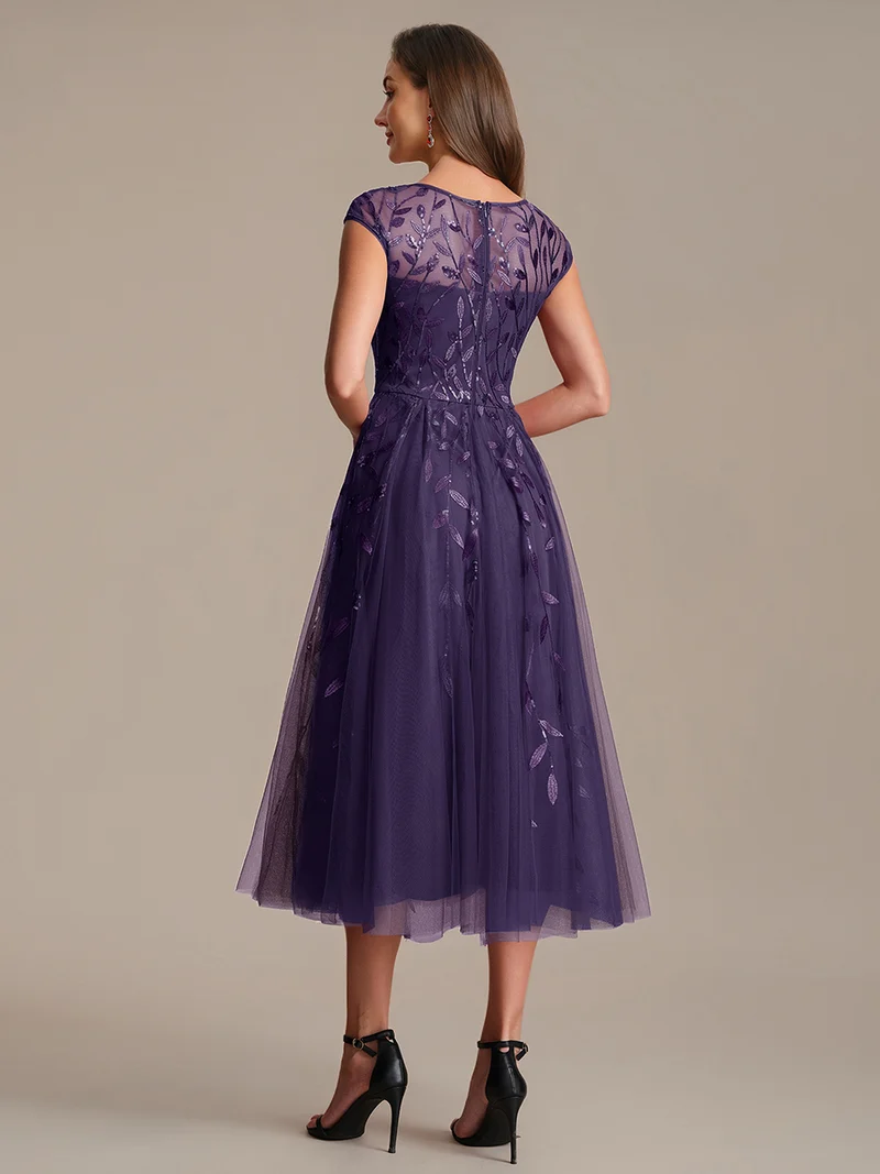 Robe de soirée mi-longue à paillettes avec manches cape
