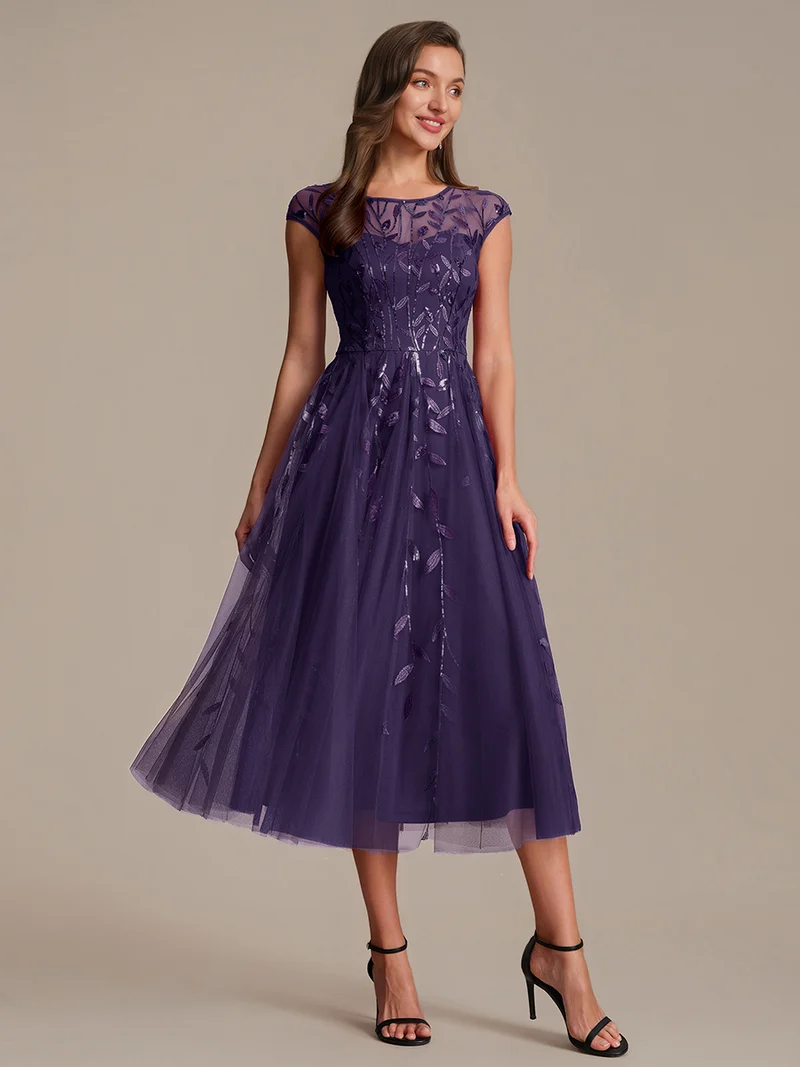 Robe de soirée mi-longue à paillettes avec manches cape