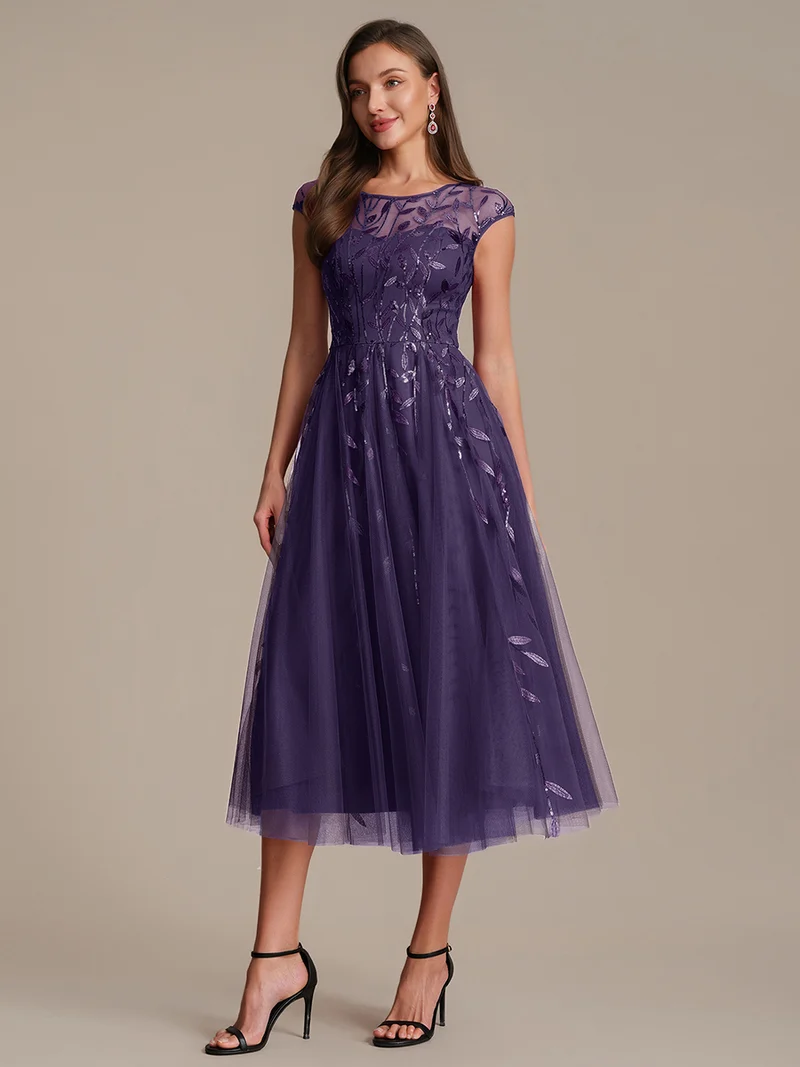 Robe de soirée mi-longue à paillettes avec manches cape
