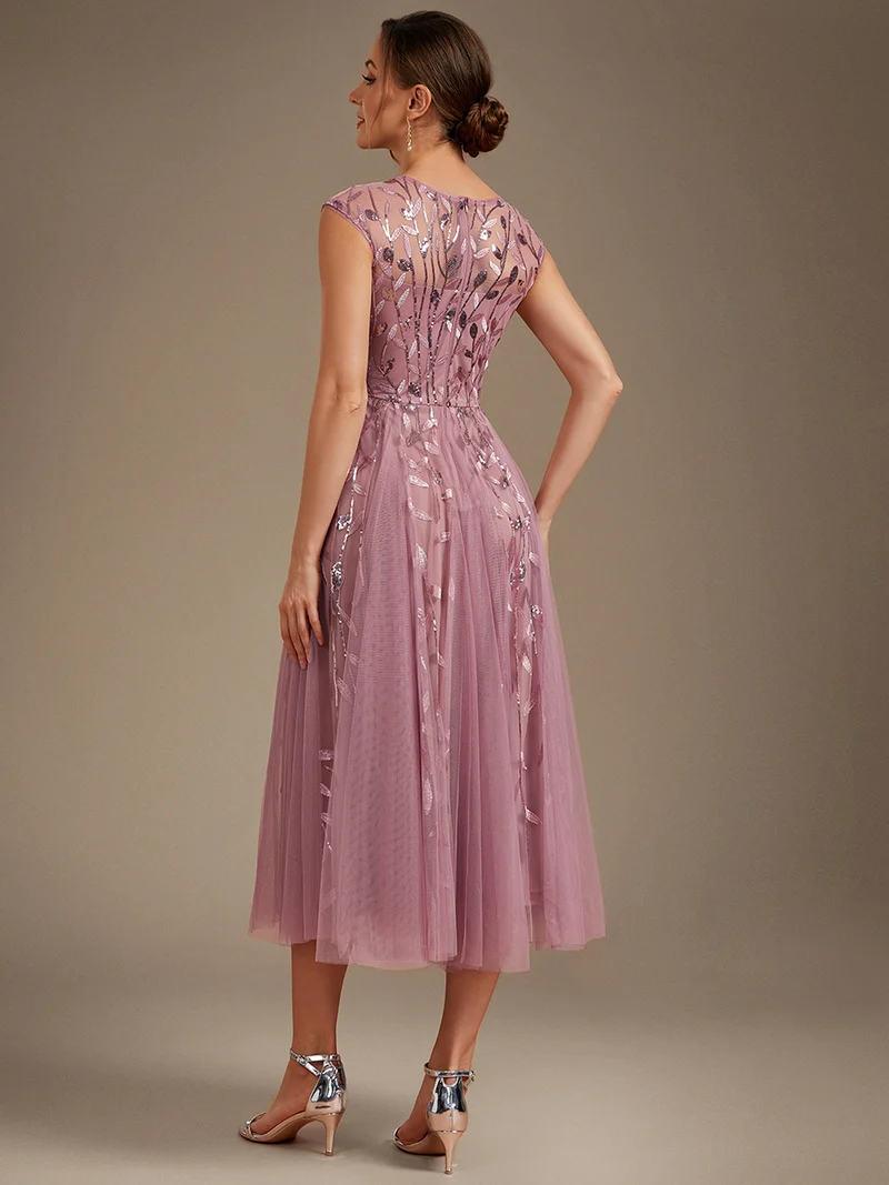 Robe de soirée mi-longue à paillettes avec manches cape