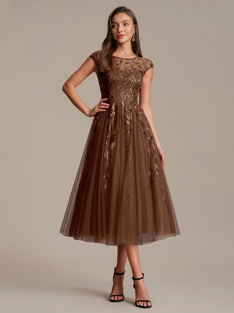 Robe de soirée mi-longue à paillettes avec manches cape
