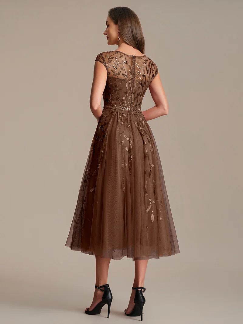 Robe de soirée mi-longue à paillettes avec manches cape