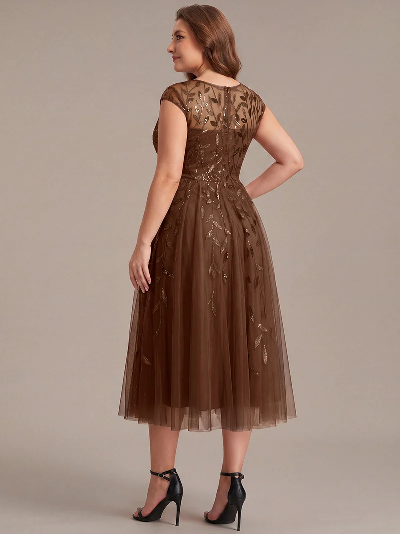 Robe de soirée mi-longue à paillettes avec manches cape