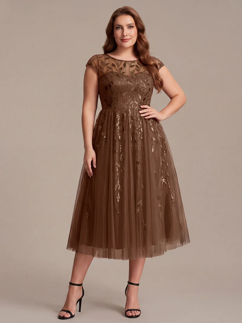 Robe de soirée mi-longue à paillettes avec manches cape