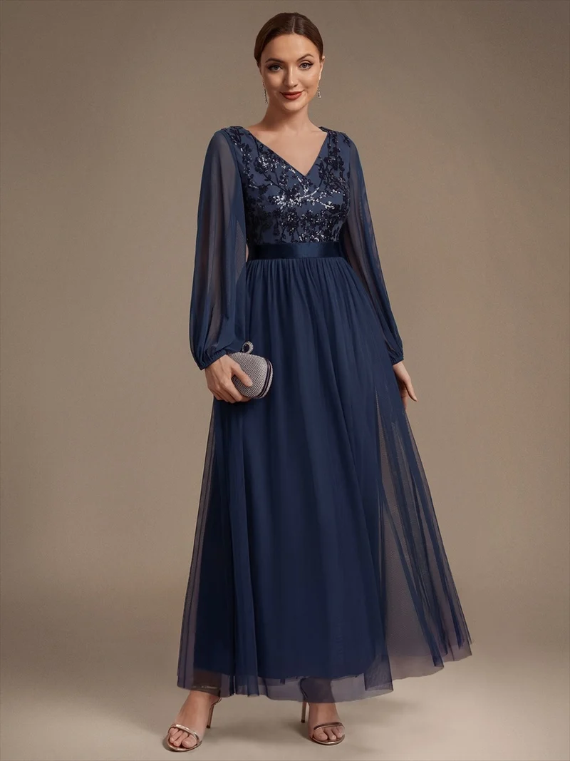 Robe longue en tulle à paillettes et manches bouffantes