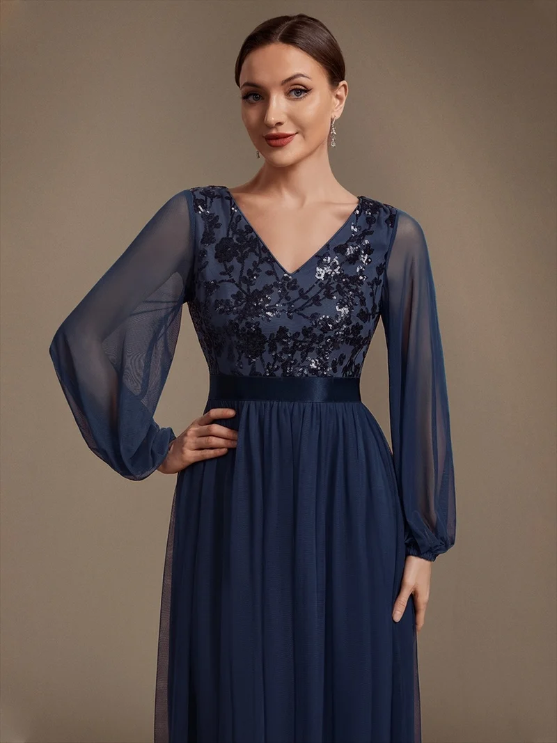 Robe longue en tulle à paillettes et manches bouffantes