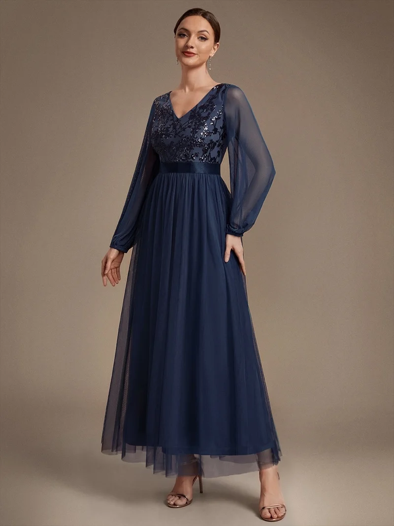 Robe longue en tulle à paillettes et manches bouffantes