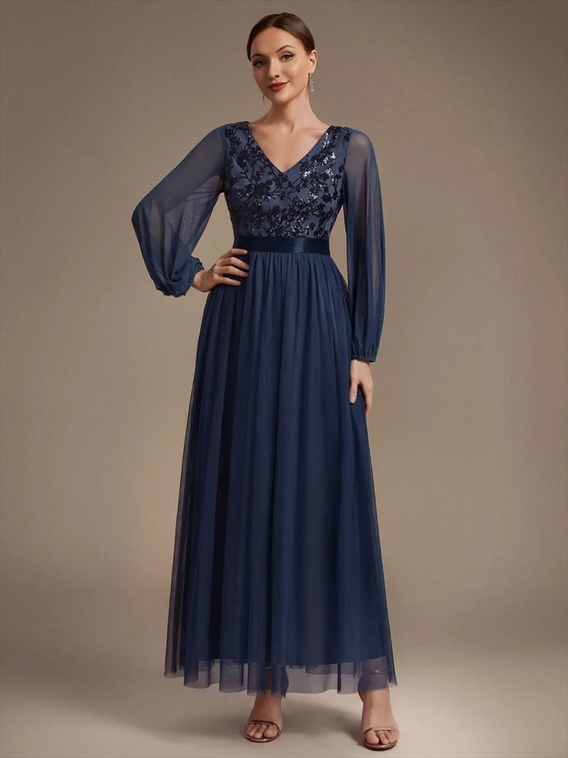 Robe longue en tulle à paillettes et manches bouffantes