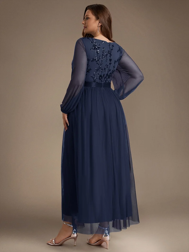 Robe longue en tulle à paillettes et manches bouffantes