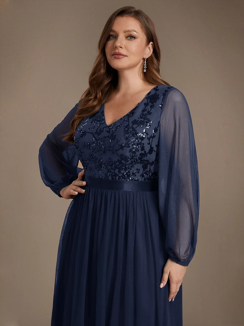 Robe longue en tulle à paillettes et manches bouffantes