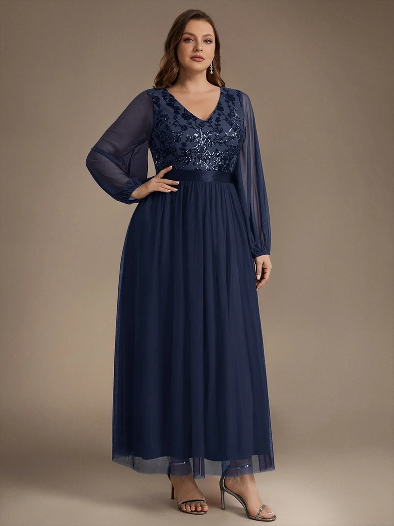 Robe longue en tulle à paillettes et manches bouffantes