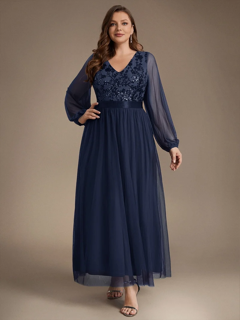 Robe longue en tulle à paillettes et manches bouffantes