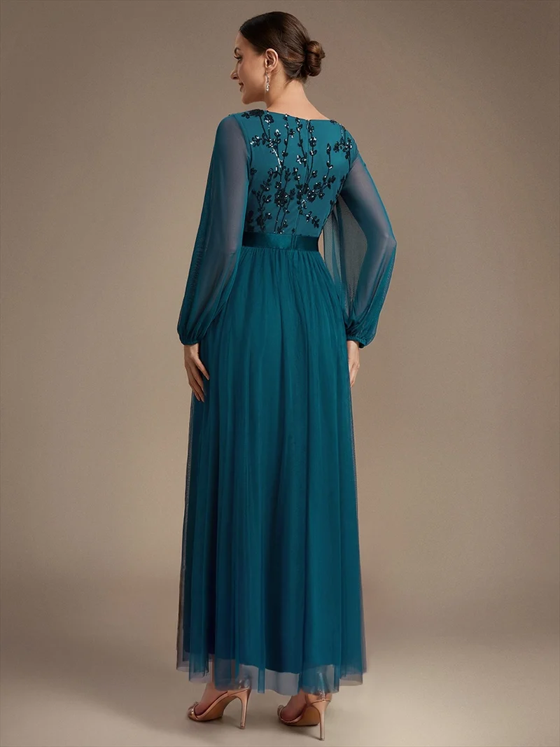 Robe longue en tulle à paillettes et manches bouffantes