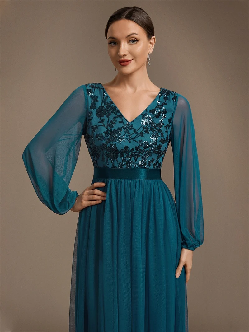 Robe longue en tulle à paillettes et manches bouffantes