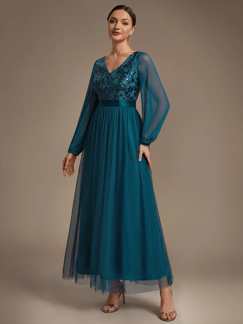 Robe longue en tulle à paillettes et manches bouffantes
