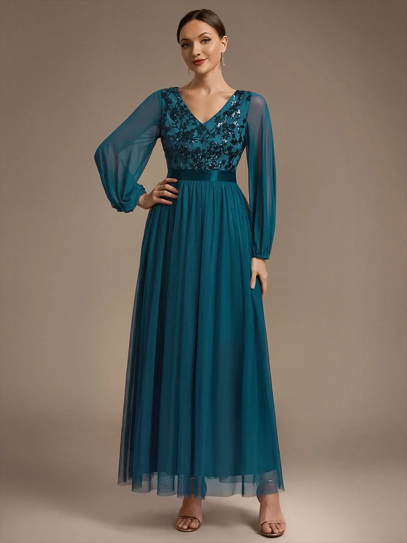 Robe longue en tulle à paillettes et manches bouffantes