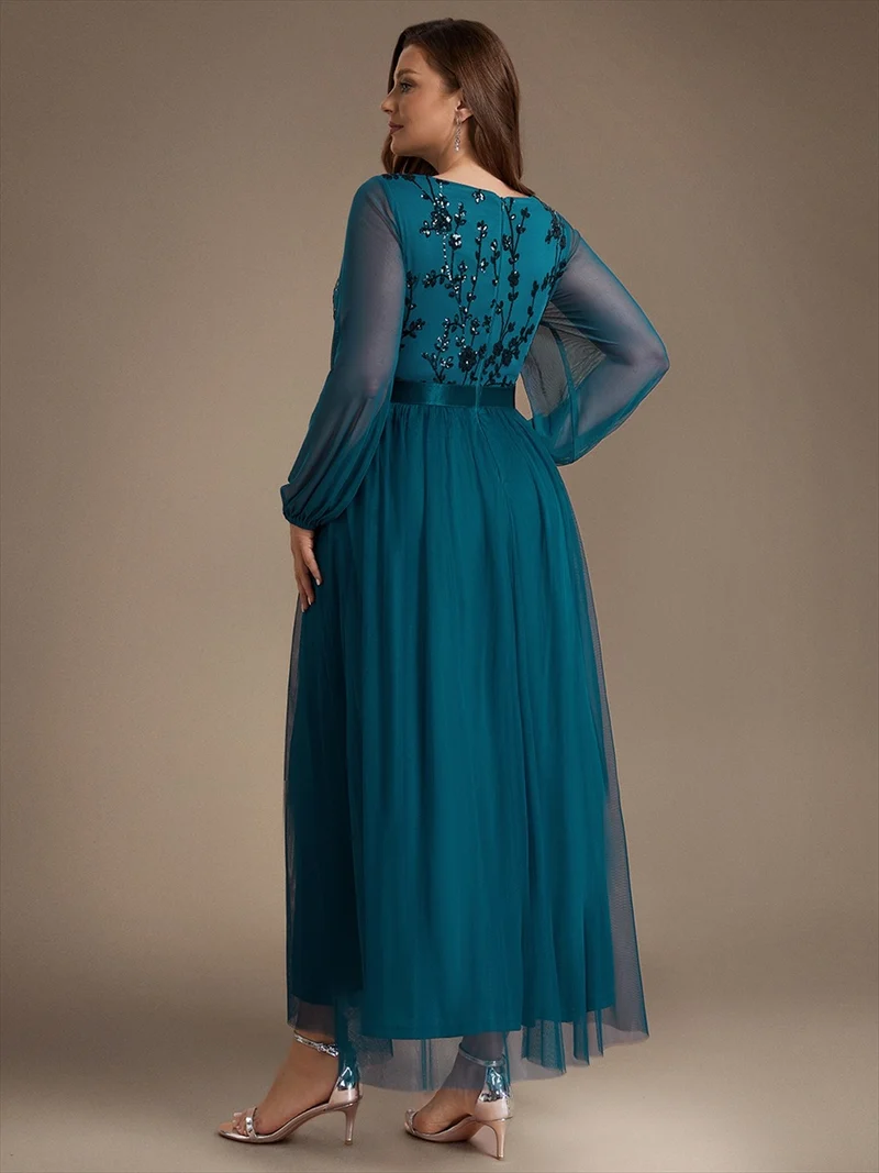 Robe longue en tulle à paillettes et manches bouffantes