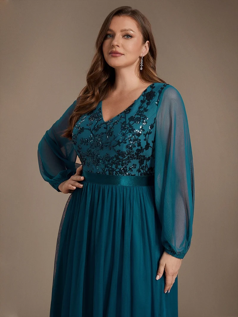 Robe longue en tulle à paillettes et manches bouffantes