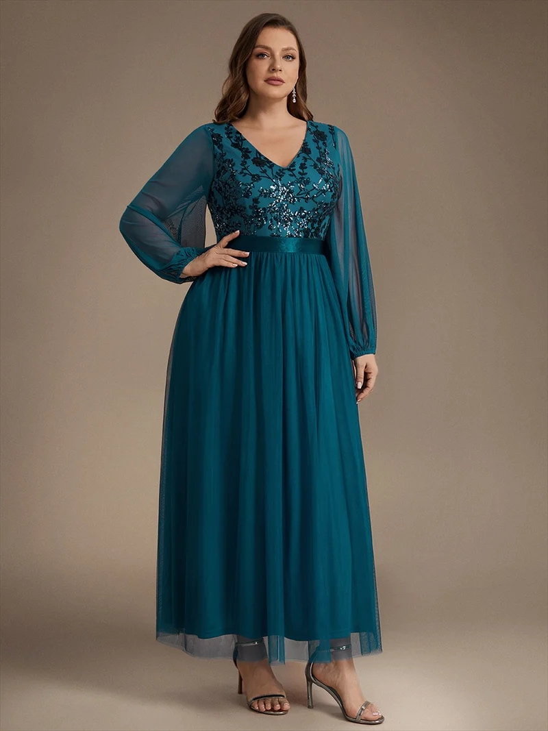 Robe longue en tulle à paillettes et manches bouffantes
