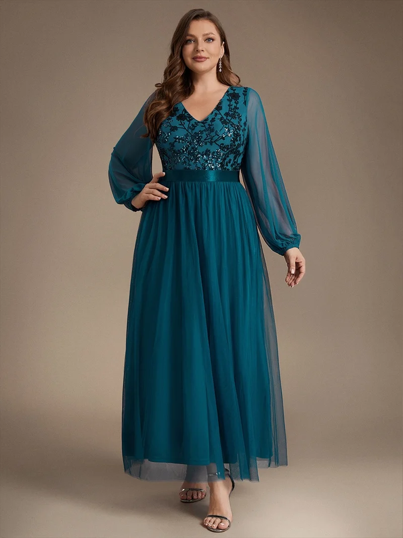 Robe longue en tulle à paillettes et manches bouffantes
