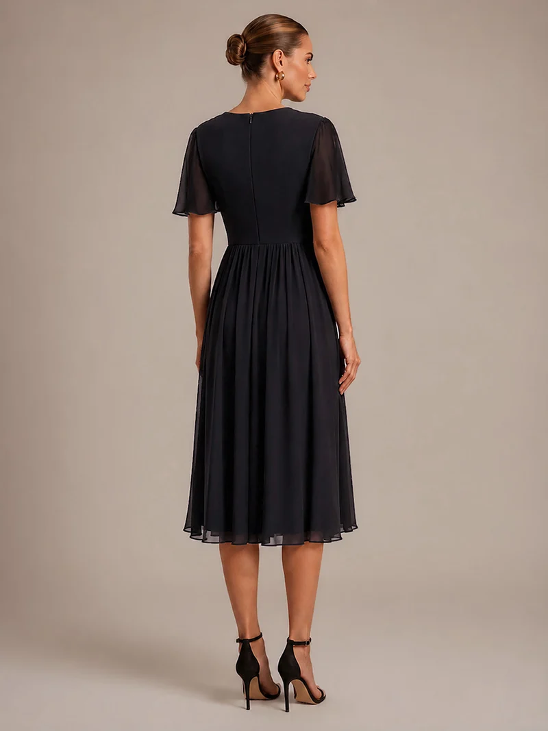 Robe midi plissée en mousseline à manches volantées