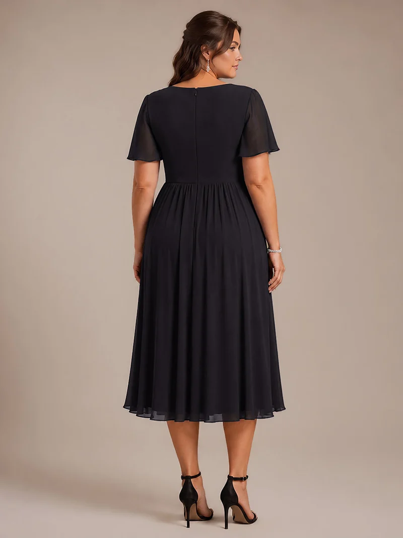 Robe midi plissée en mousseline à manches volantées
