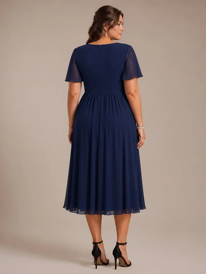 Robe midi plissée en mousseline à manches volantées