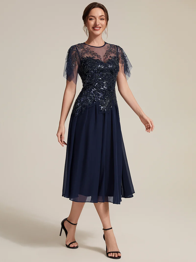 Robe midi en tulle ornée de perles et de paillettes, avec manches volantées