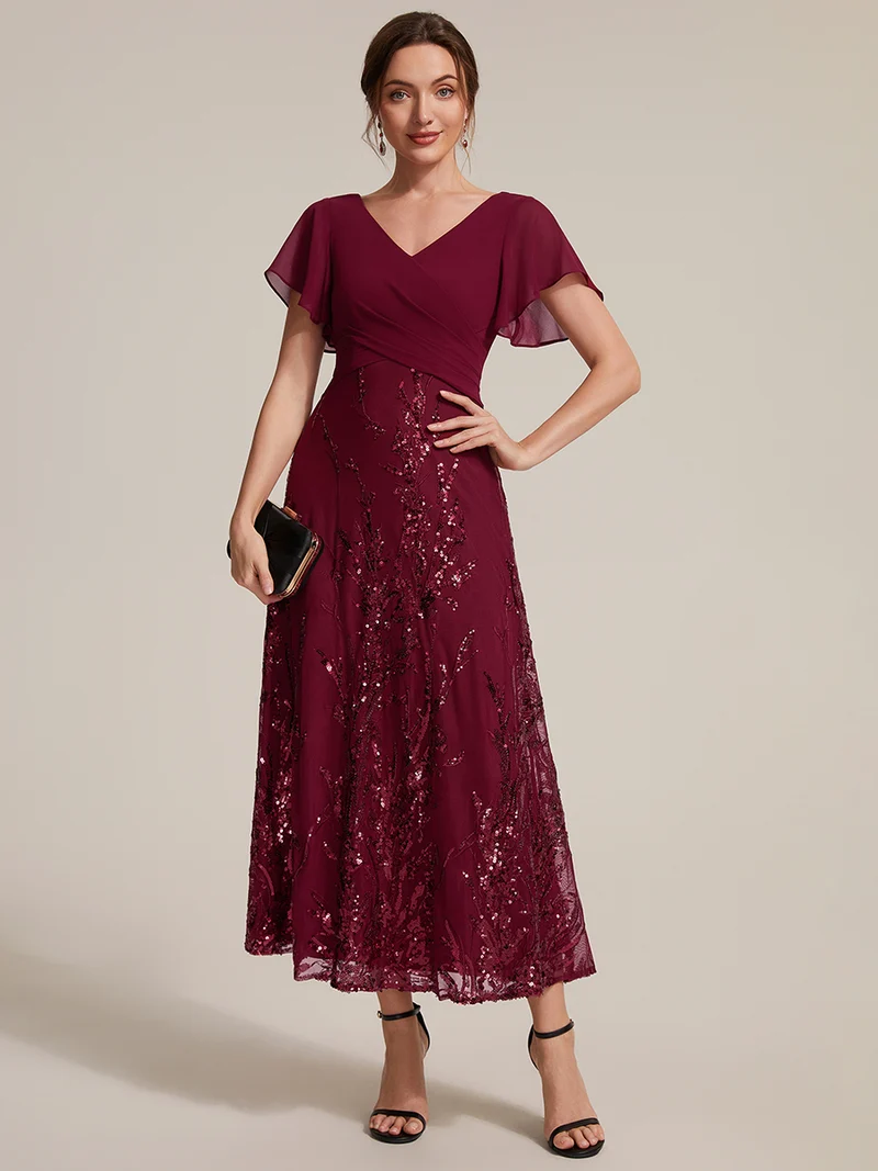 Robe midi en mousseline à paillettes avec col V et manches volantées