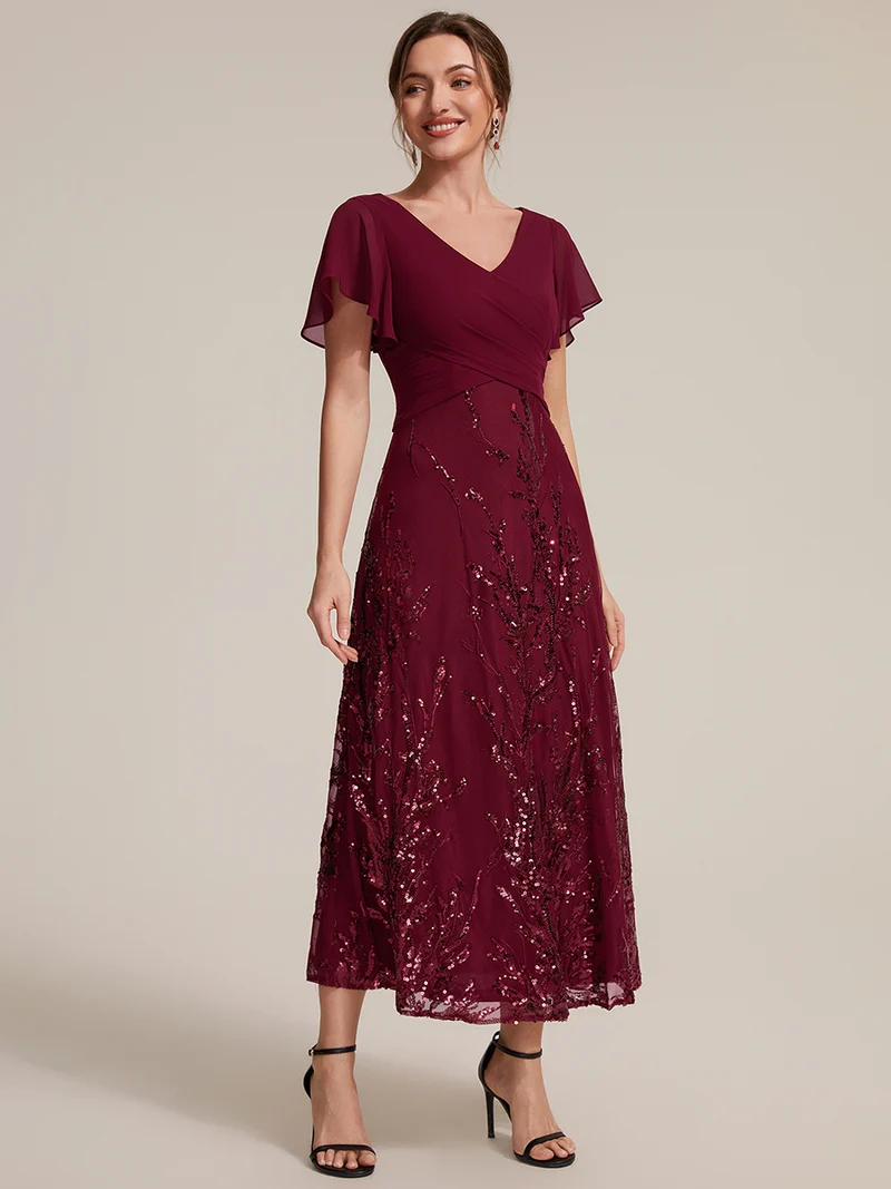 Robe midi en mousseline à paillettes avec col V et manches volantées