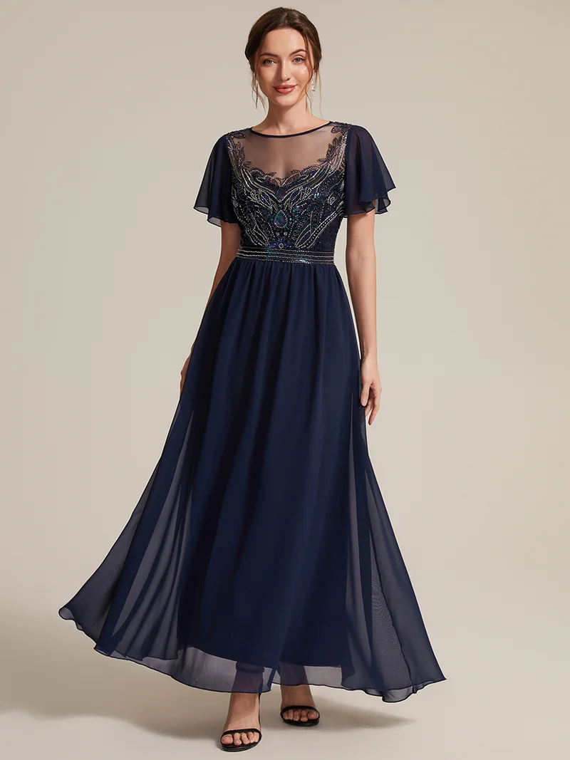Robe longue en tulle perlée à coupe trapèze et manches volantées
