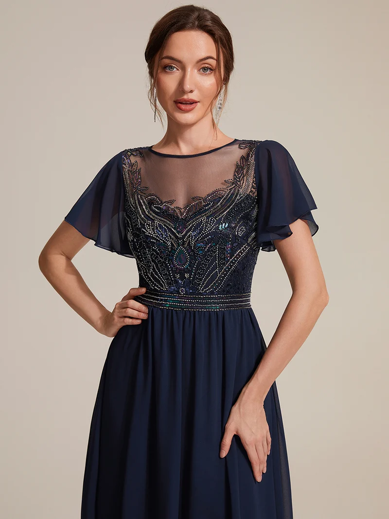 Robe longue en tulle perlée à coupe trapèze et manches volantées