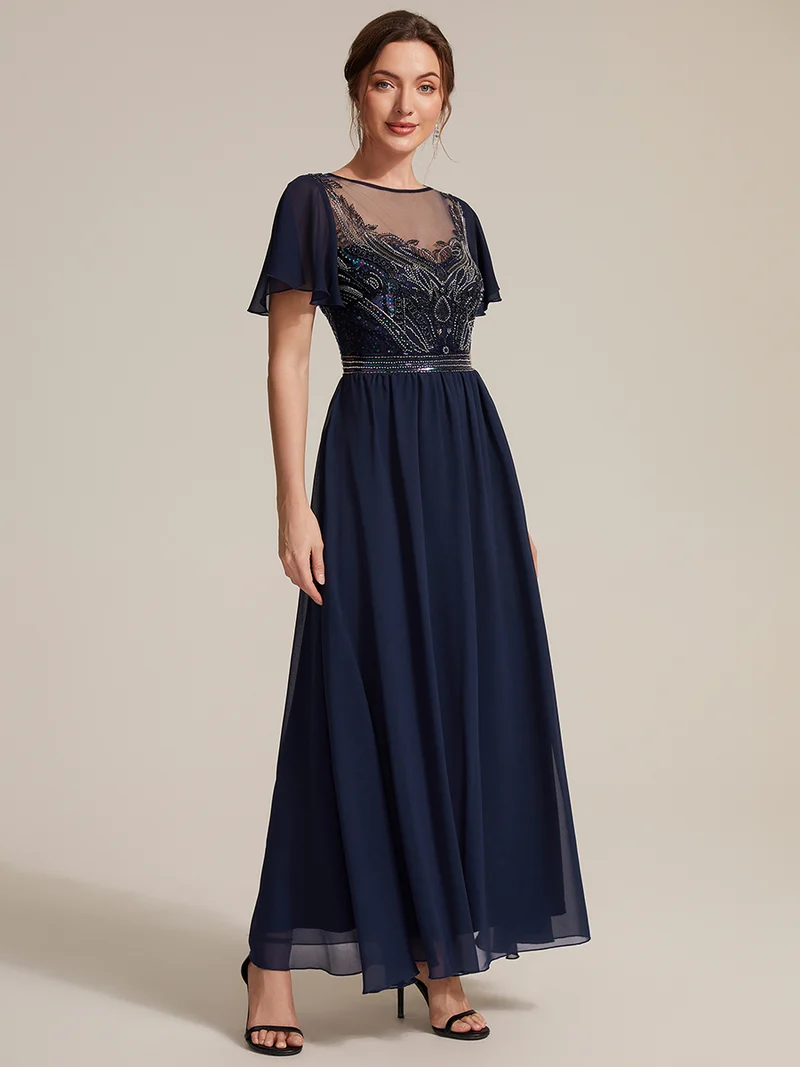 Robe longue en tulle perlée à coupe trapèze et manches volantées