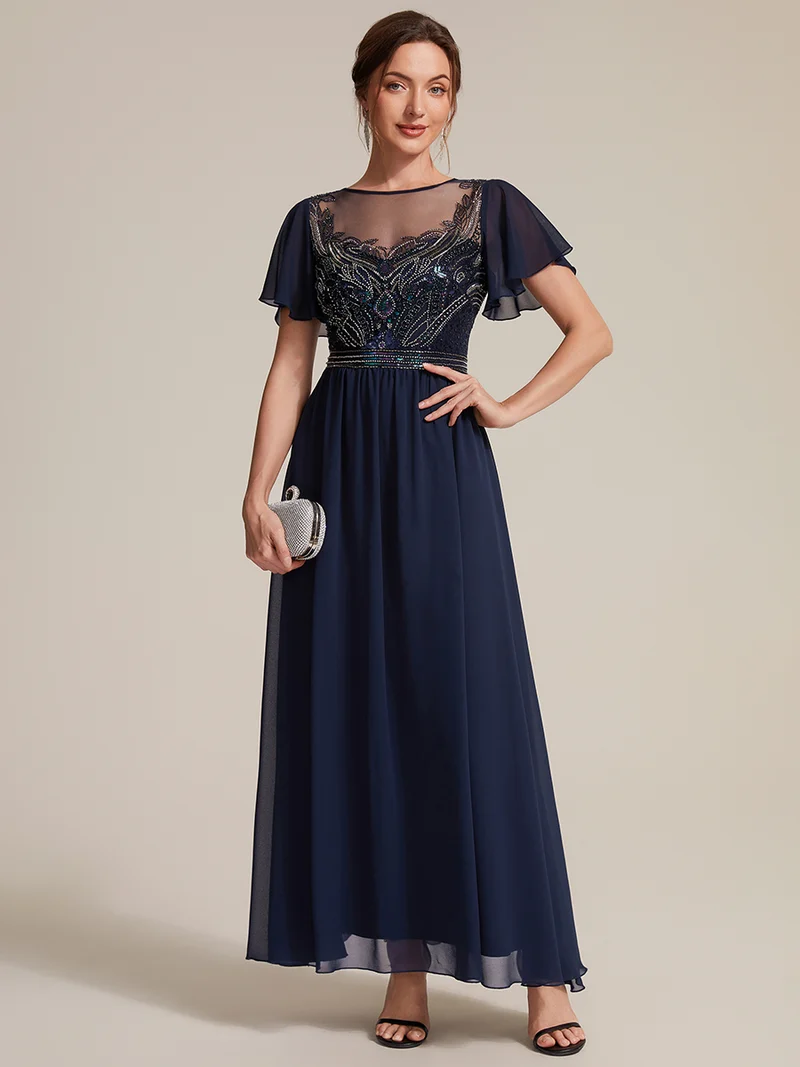 Robe longue en tulle perlée à coupe trapèze et manches volantées