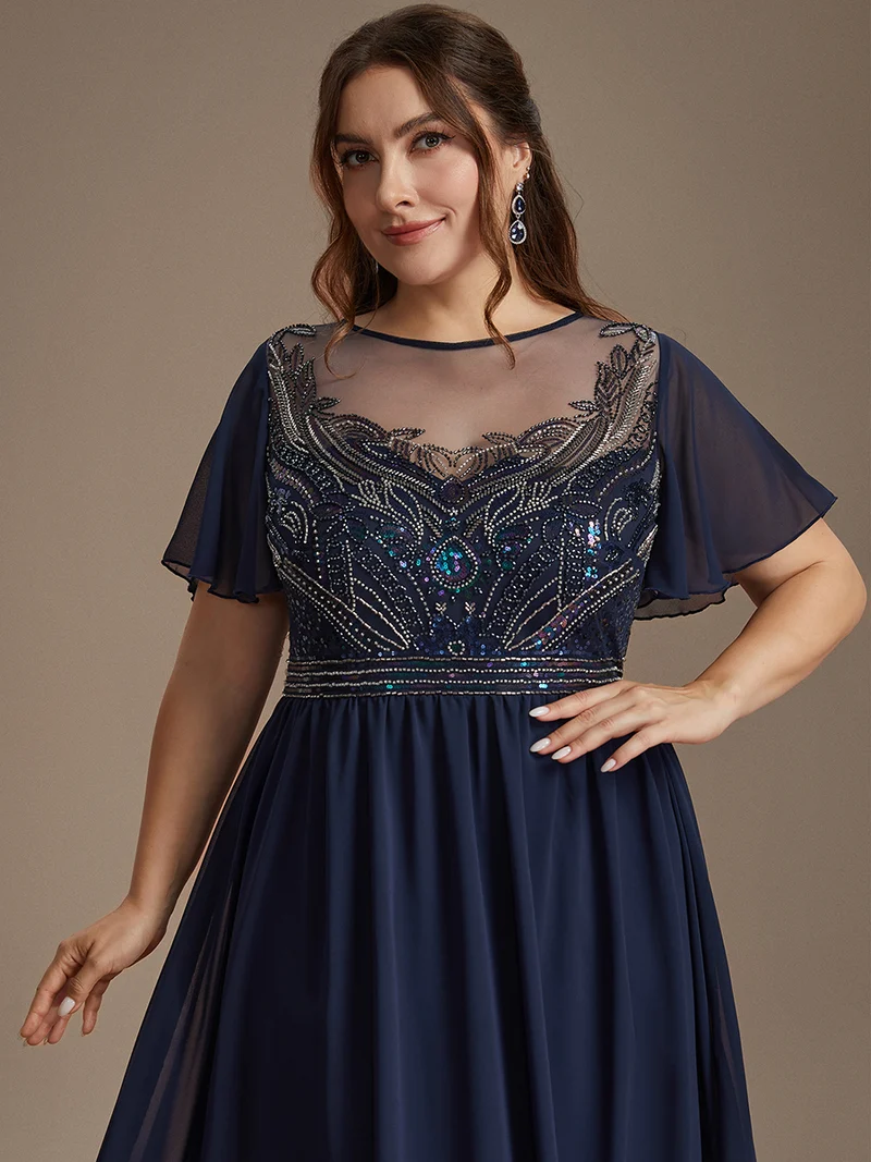Robe longue en tulle perlée à coupe trapèze et manches volantées